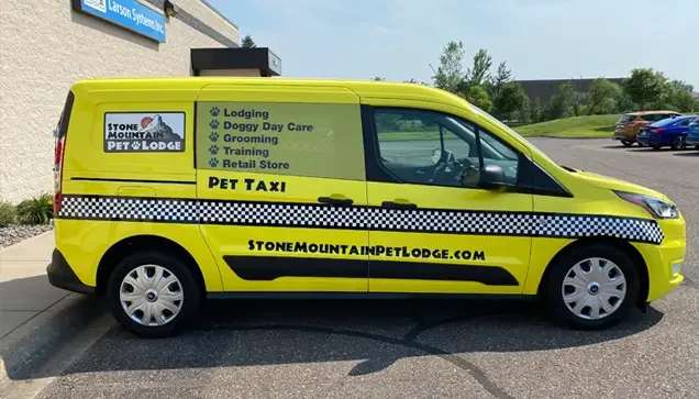 Yellow pet taxi at Stone Mountain Pet Lodge near Osseo, MN.
